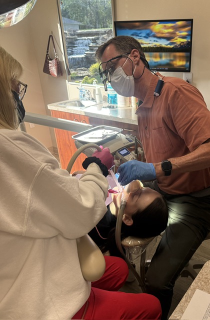 Dr. Bartels with patient in dental chair