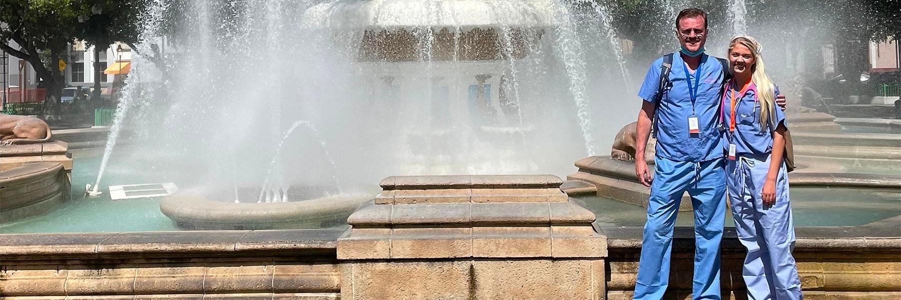 Bartels family dentistry team in front of a fountain