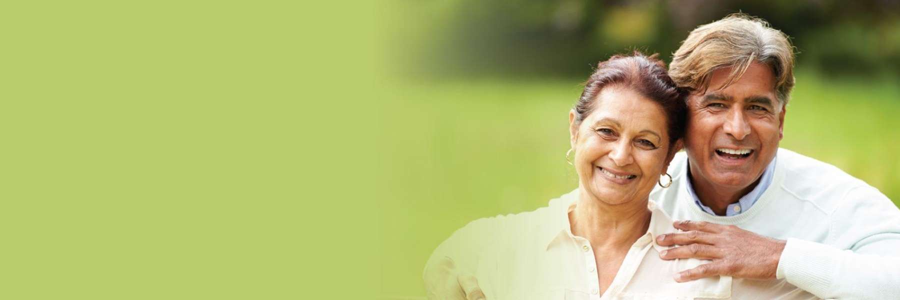 A smiling couple in the park | Jonesboro dentist